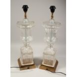 A LARGE PAIR OF GLASS URN SHAPED LAMPS 24ins high.