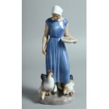 A B & G DANISH PORCELAIN FIGURE "THE CHICKEN GIRL". No. 2220. 8.5ins high.