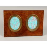 A WALNUT FRAMED PHOTOGRAPH FRAME with two ovals. 14ins x 9ins.