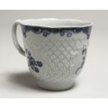 A Wm. REID RARE LIVERPOOL COFFEE CUP with a scale moulded body, moulded cartouches, painted with