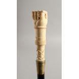 A BONE HANDLED WALKING STICK CARVED AS A HAND. 35ins long