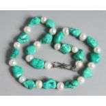 A TURQUOISE AND PEARL BEAD NECKLACE. 17ins long.