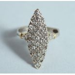 A DIAMOND SET GOLD MARQUEE RING.