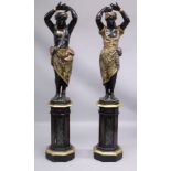 A SUPERB PAIR OF PERIOD ITALIAN CARVED PAINTED AND GILDED BLACKAMOOR FIGURES ON STANDS 6ft 2ins high