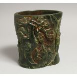 A CHINESE JADE BRUSH POT covered with figures and lotus. 6ins high.