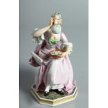 A B & G DANISH PORCELAIN FIGURE " YOUNG LADY WITH A WINE BOTTLE". 5.35 ins high.