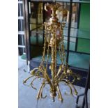 A GOOD ORNATE BRASS EIGHT BRANCH CHANDELIER.