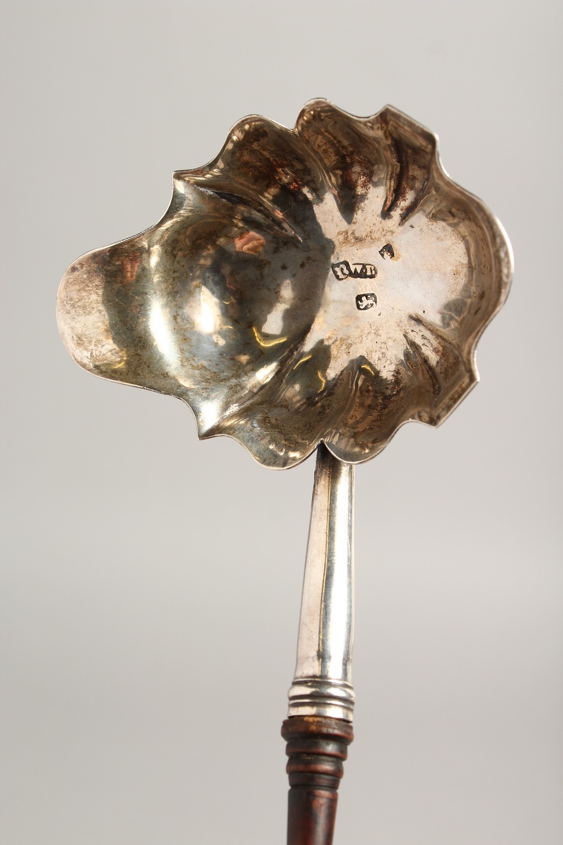 A GEORGE III SILVER PUNCH LADLE with turned wood handle. London 1772. Maker, W. B. - Image 2 of 6