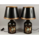 A PAIR OF BLACK TOLEWARE LAMPS AND SHADES.