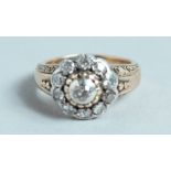 A VICTORIAN DIAMOND SET CLUSTER RING.
