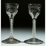 A PAIR OF GEORGIAN WINE GLASSES the bowls engraved with a bird, thistle and leaves, with white