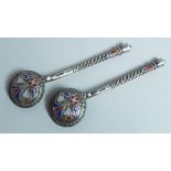 A PAIR OF RUSSIAN SILVER AND ENAMEL SPOONS. 7.5cm long, stamped 88.