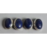 A PAIR OF SILVER AND LAPIS CUFF LINKS.
