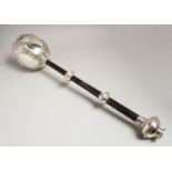 A SILVER MACE with wooden handles, presented to ASSHETON-LEAVER ESP. ENTRE NOUS. 25ins long,