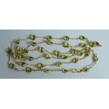 A GOOD 18CT GOLD PERIDOT NECKLACE.