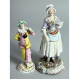 A PORCELAIN FIGURE OF A JESTER, 6ins high and a figure of a LADY HOLDING A LETTER. 8ins high (2).