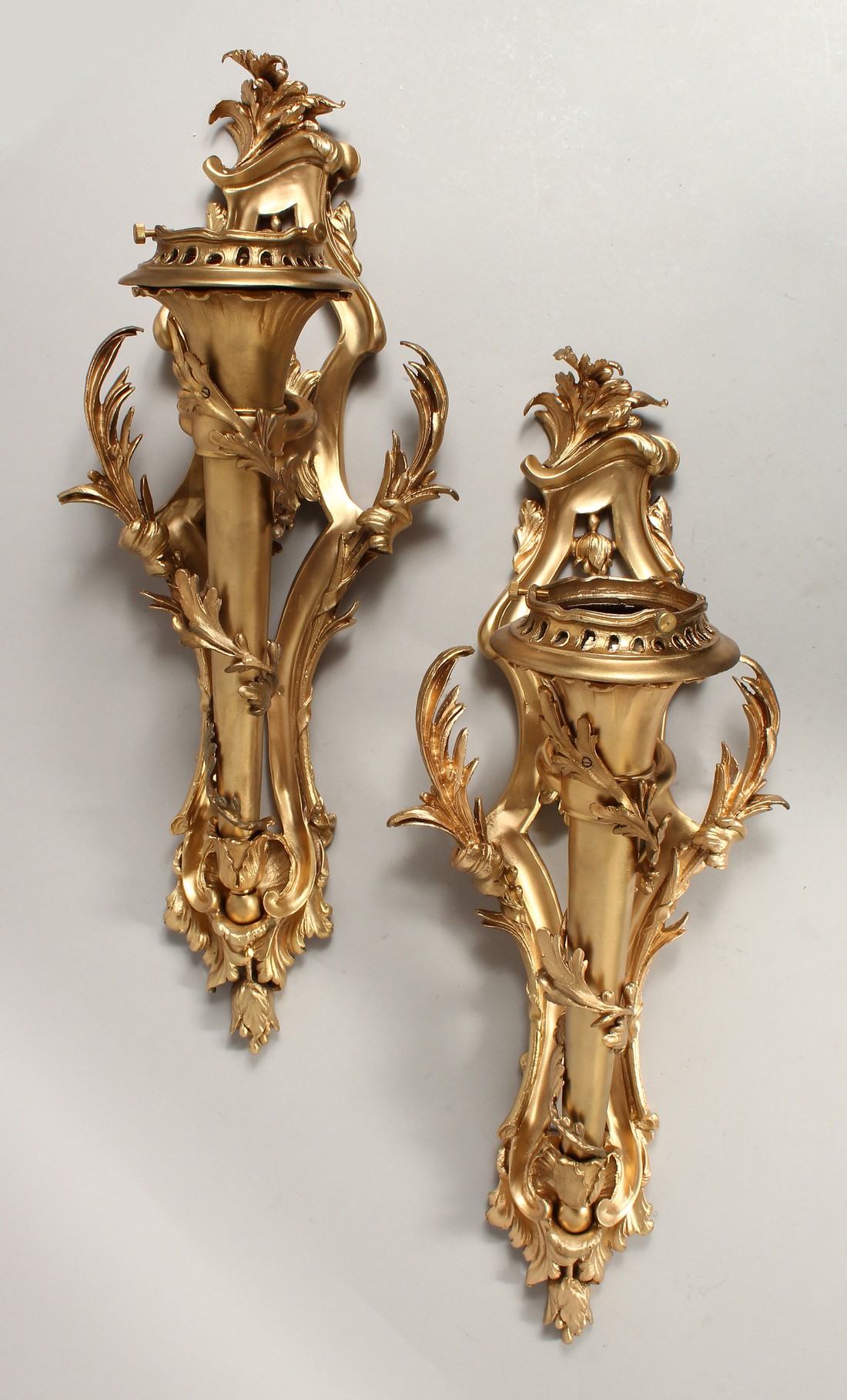 A GOOD PAIR OF GILT BRONZE SCONCES, AS TORCHES with acanthus scrolls.