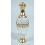A GEORGIAN GOLD MOUNTED SCENT BOTTLE in a leather case. 10cm.