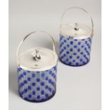 A PAIR OF BLUE OVERLAY CUT GLASS BISCUIT BARRELS with plated lid and handles.