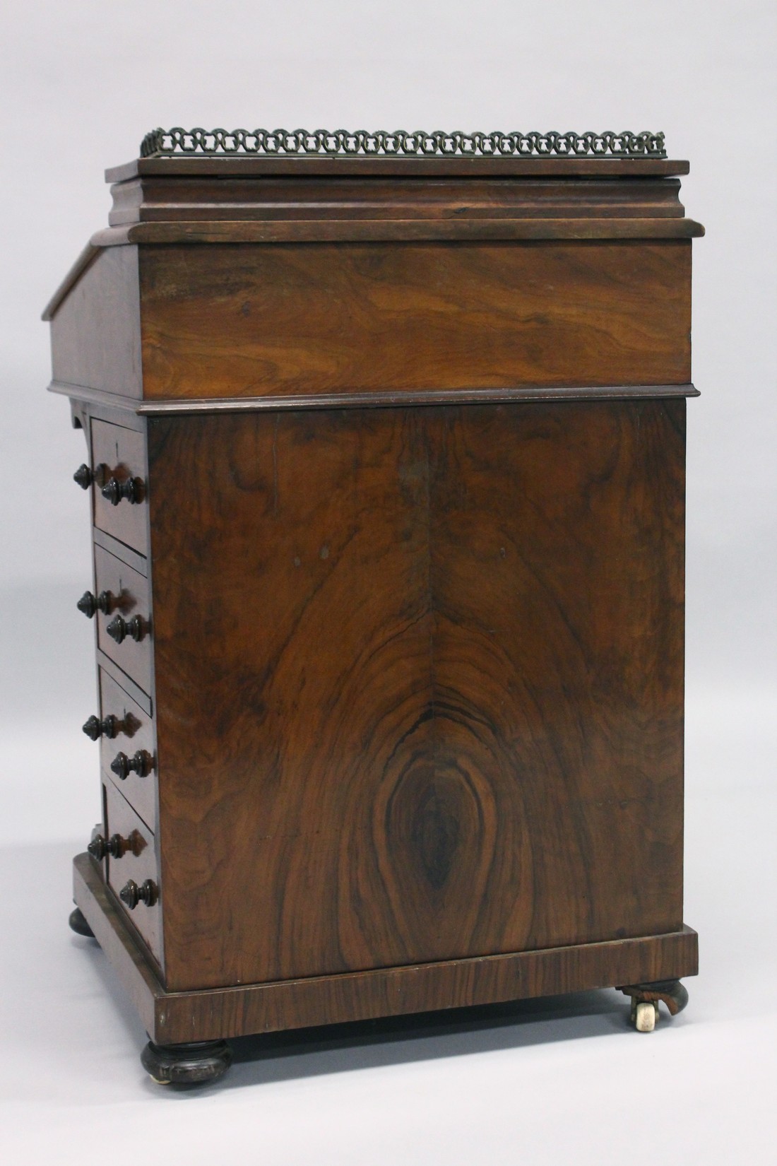 A GOOD VICTORIAN WALNUT DAVENPORT, brass grill, leather writing surface, fitted interior, four - Image 6 of 6