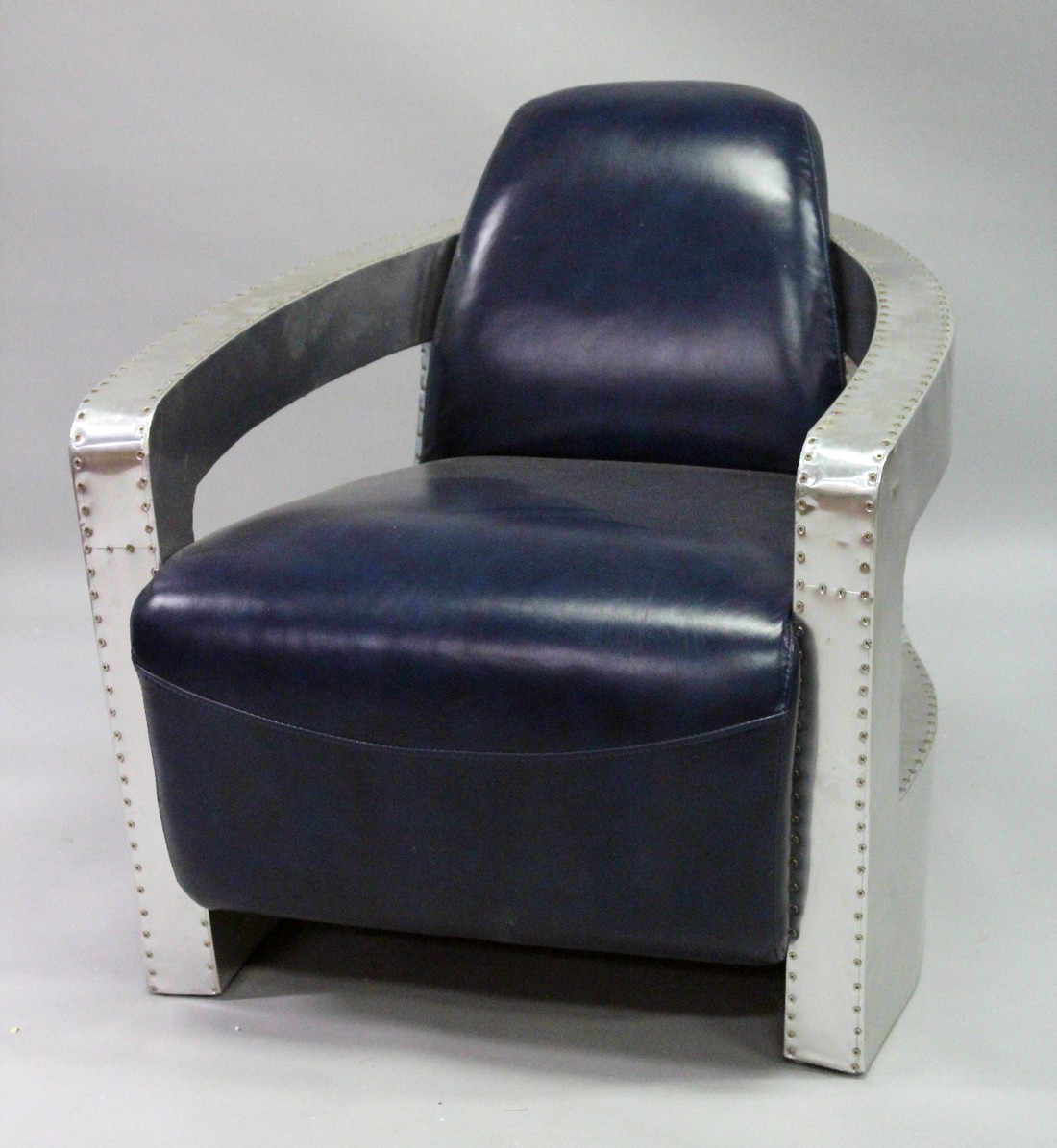 AN ART DECO DESIGN METAL AND LEATHER ARMCHAIR.