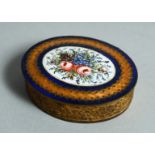 A SMALL GILT METAL OVAL PATCH BOX with enamel top. 2ins long.