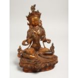 A CHINESE GILT BRONZE SEATED DEITY, with coral and turquoise. Signed. 9ins high.