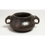 A GOOD CHINESE CIRCULAR BRONZE TWO HANDLED CENSER with elephant handles and inlaid with silver. 6.