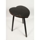 A WOODEN STOOL with heart shaped top. 21.5" high