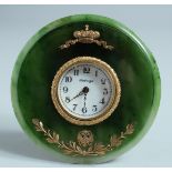 A SUPERB RUSSIAN SILVER GILT AND JADE CIRCULAR CLOCK on an easel support. 11cm diameter. Mark: R A.,