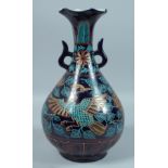 A CHINESE PETAL SHAPED BLUE GROUND VASE decorated with a phoenix and flowers. 15ins high.