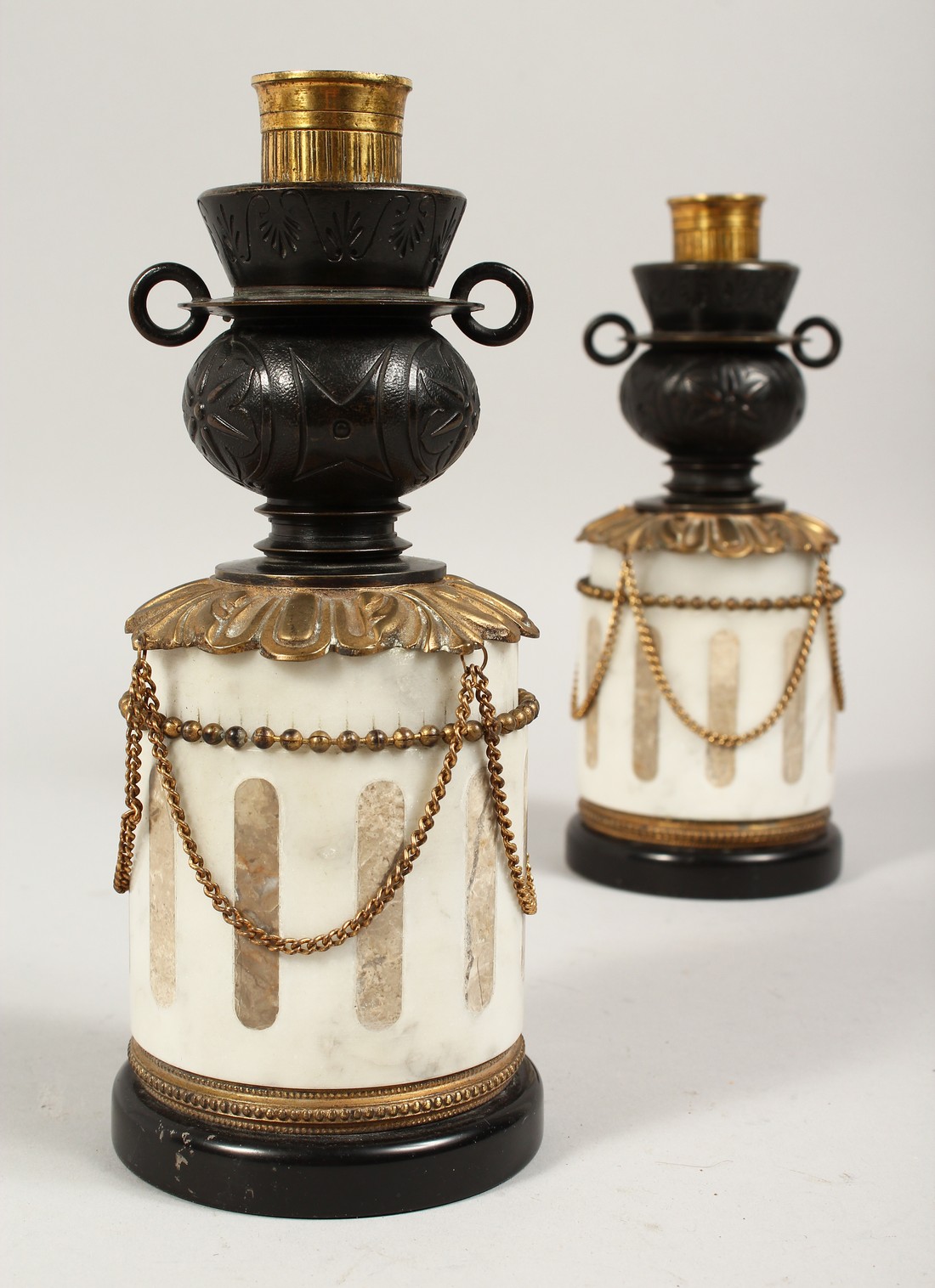 A VERY GOOD PAIR OF REGENCY, BRONZE AND MARBLE TWO-HANDLED CASSOLETTES ON STANDS hung with rope. 9.