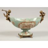 AN OVAL PORCELAIN BOWL with gilt cherubs handles and base. 11ins wide.