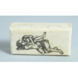 A BONE BOX with folding top, erotic scene. 2.5ins.