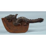 A TIBETAN BRONZE DRAGON AXE. 13ins long.