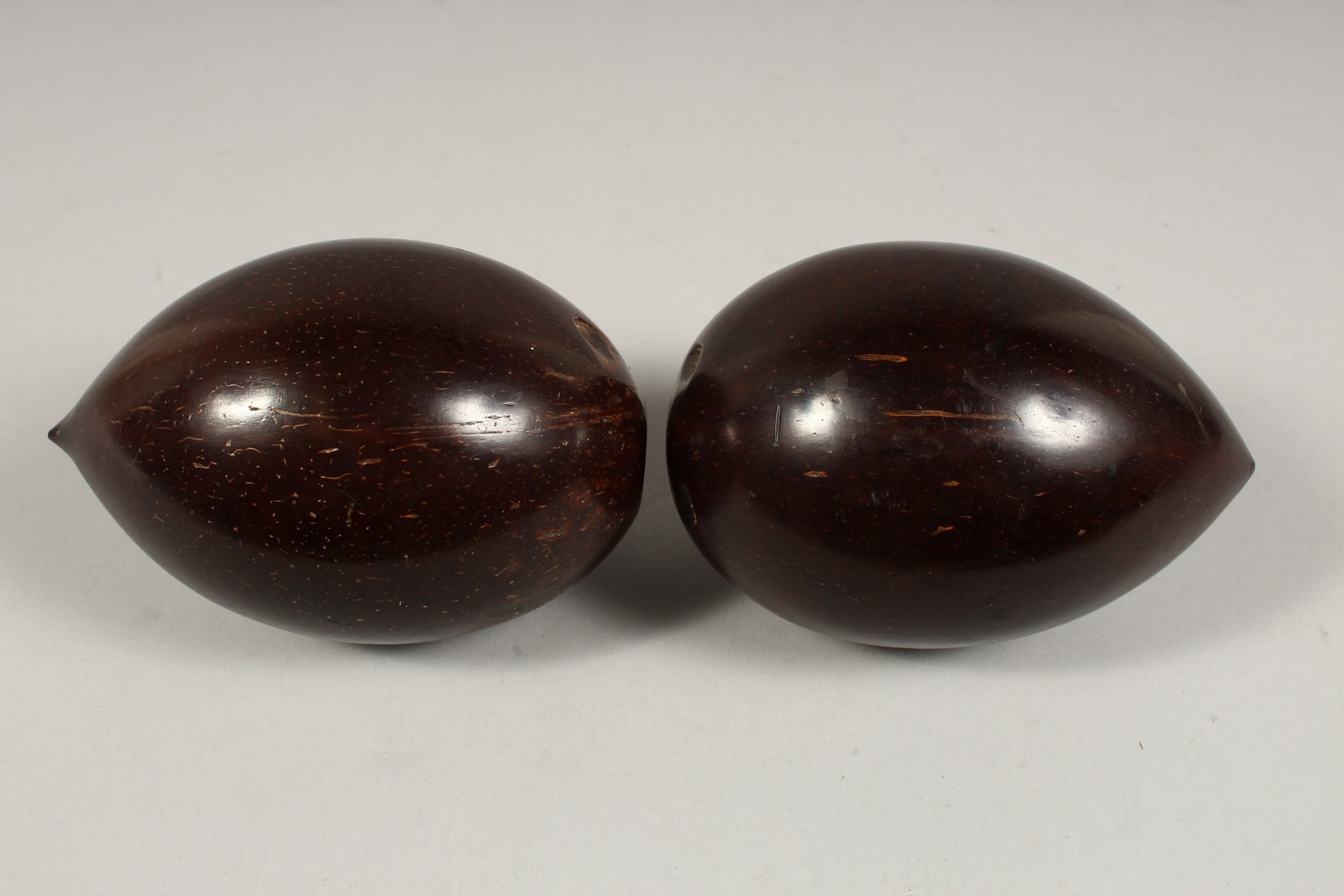 TWO POLISHED COCONUTS. 5.5ins - Image 2 of 3