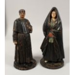 A RARE PAIR OF 19TH CENTURY PORTUGUESE FIGURES OF A MAN AND A WOMAN. 16ins high.