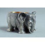 A RUSSIAN SILVER ELEPHANT SALT with silver gilt interior. Mark 84. 4.5cm long.