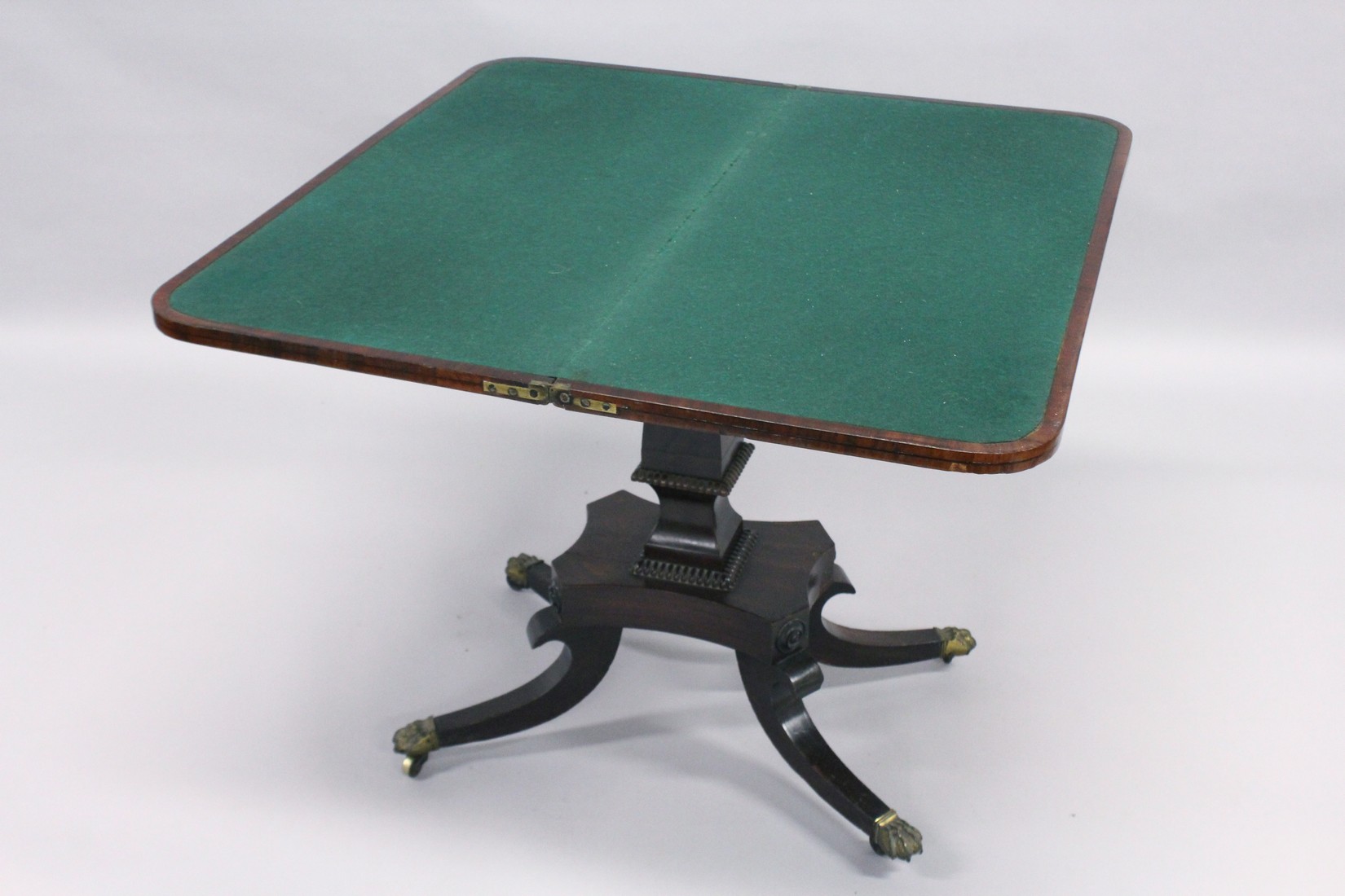 A REGENCY MAHOGANY CARD TABLE with cross band top and green baize interior, on a centre column - Image 6 of 8