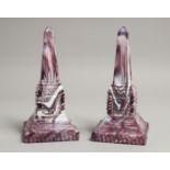 A PAIR OF SLAG GLASS OBELISKS. 8ins high.