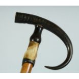 A SWISS WALKING STICK 'GRINDULWALD' with bone handle and hoof. 35ins long.