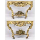 A VERY GOOD NEAR PAIR OF 18TH CENTURY CARVED AND GILDED CONSOLE TABLES with serpentine marble