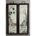 A PAIR OF MAHOGANY FRAMED CHINESE PORCELAIN PLAQUES. 28ins long x 8ins wide.