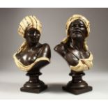 A VERY GOOD PAIR OF NORTH AFRICAN POTTERY BUSTS of a man and a young lady 12ins high.