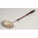 A GEORGE III SILVER PUNCH LADLE with turned wood handle. London 1772. Maker, W. B.