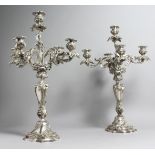 A GOOD PAIR OF ROCOCO STYLE SILVER PLATED FOUR BRANCH, FIVE-LIGHT CANDELABRAS, of naturalistic