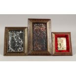 THREE LEATHER PHOTOGRAPH FRAMES