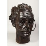 A BRONZE BUST OF SALVADOR DALI. 14ins high.