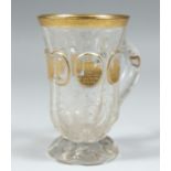 A GOOD CLEAR GLASS BOHEMIAN TANKARD with four gilt oval panels of buildings 4.5ins high.