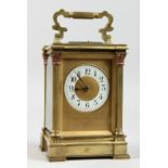 A GOOD GOLDSMITHS & SILVERSMITHS BRASS CARRIAGE CLOCK with repeat action and column supports. 6ins